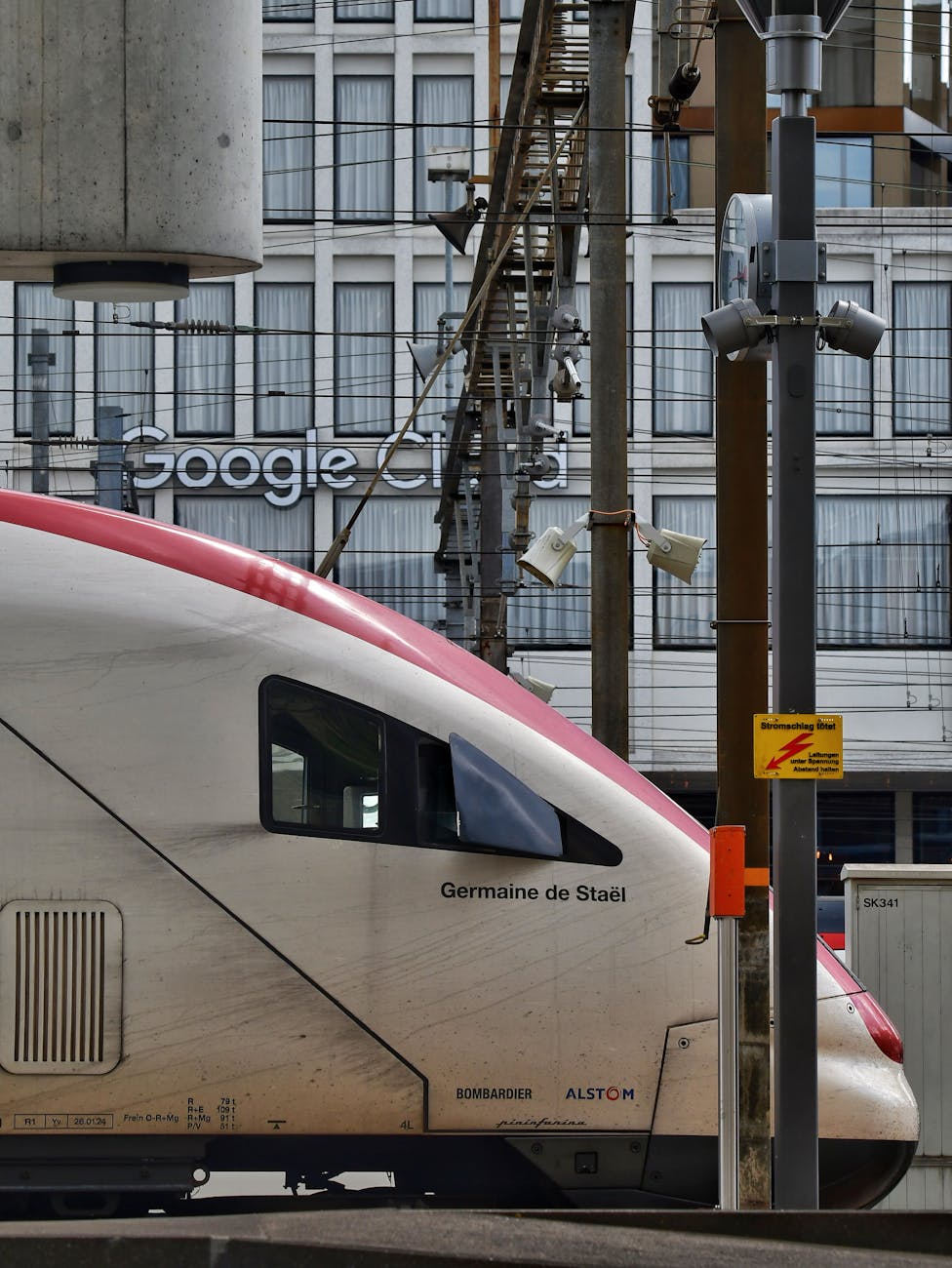 high speed train passing urban backdrop